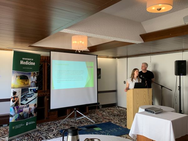 Two people presenting at the Department of Medicine Faculty Research Day,