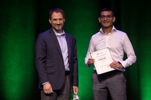 Jay Shavadia receives award from Josh Lawson.