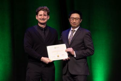 Dr. Bertrand receives an award. 