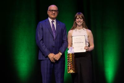 Dr. Lang receives an award.