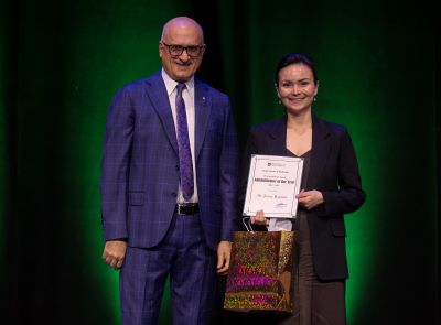 Dr. Baptiste receives and award.
