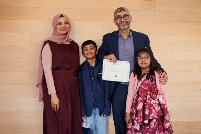 Dr. Samad receives award with family.