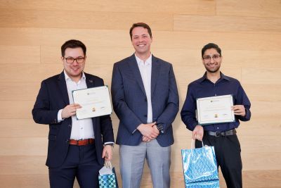 Dr. Haque and Dr. Hick receive their awards.