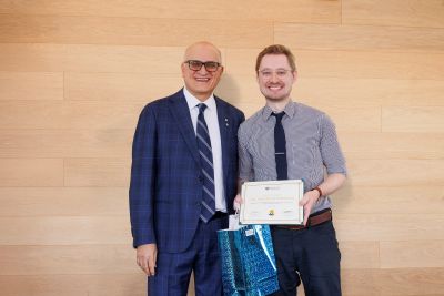 Dr. Kolbenson receives award.