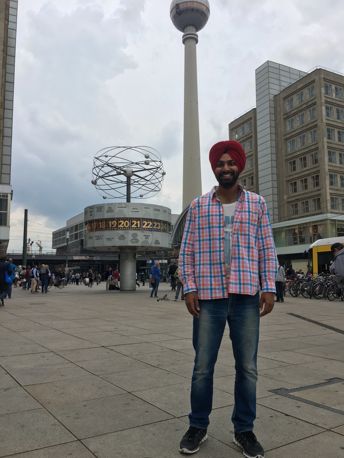 Singh poses in front of the World Clock and TV Tower in Berlin.