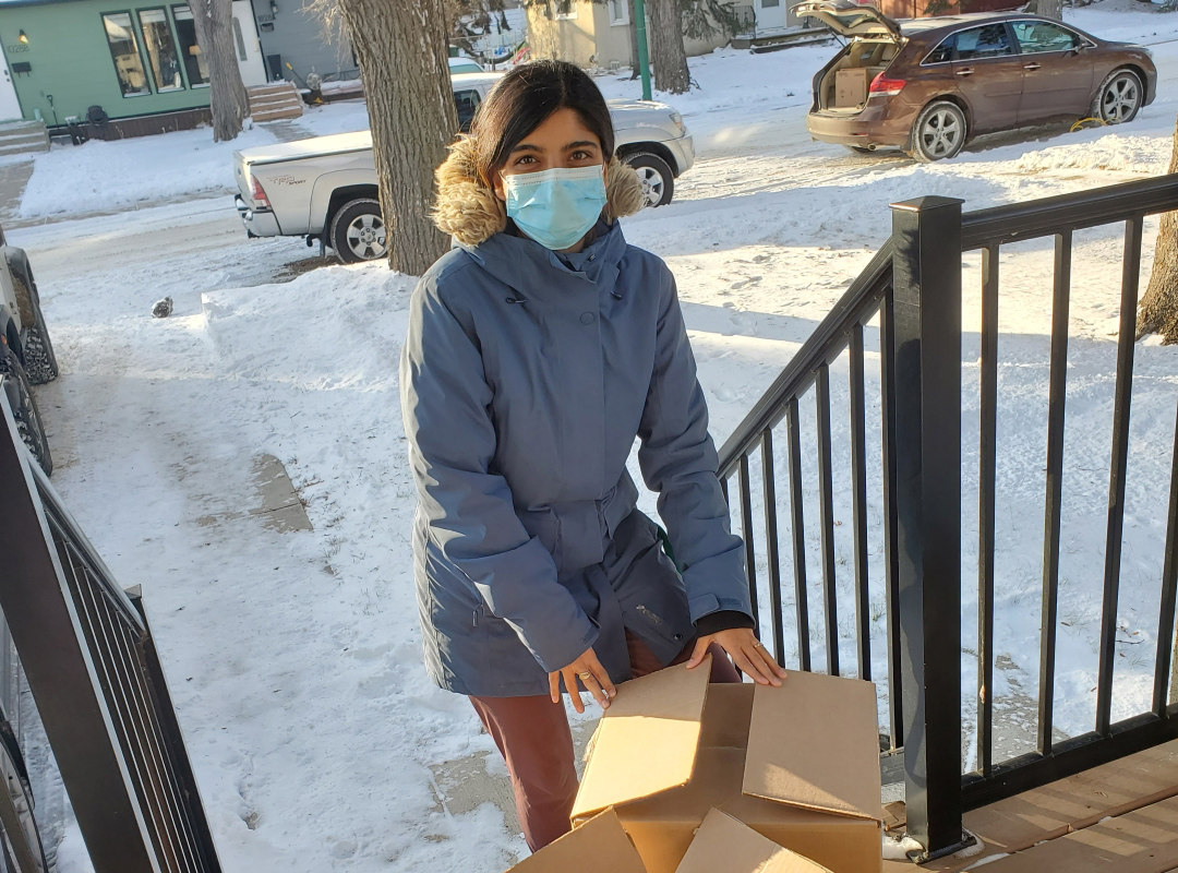 Medical student Rubia Ahmed is seen gathering donations for a clothing drive organized by students to be distributed by Okihycitawak Patrol Group. (Submitted photo)