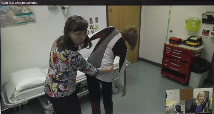 Dr. Lovo-Grona uses the Telehealth unit for a mock assessment with Louise Kowal,  a Nurse Practitioner in Arborfield