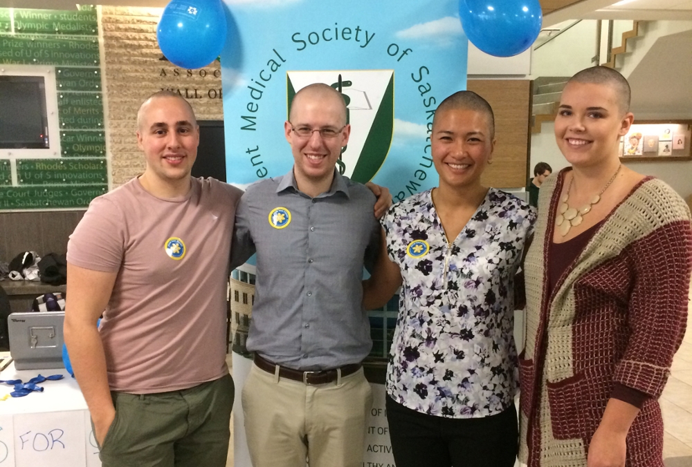 Spencer Zwarych, Spencer Gall, Bonnie Liu, Megan McDonald pose after having their hair cut in support of the Canadian Cancer Society.