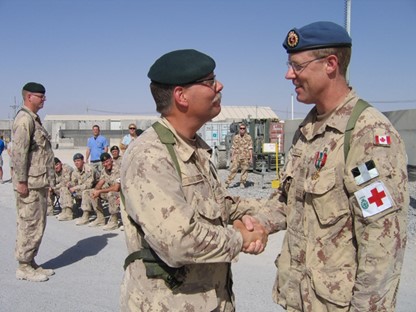 Dr. Scott McLeod (MD), at right, receiving his service medal on deployment with the Canadian Armed Forces in Afghanistan in 2008. (Photo: Submitted)