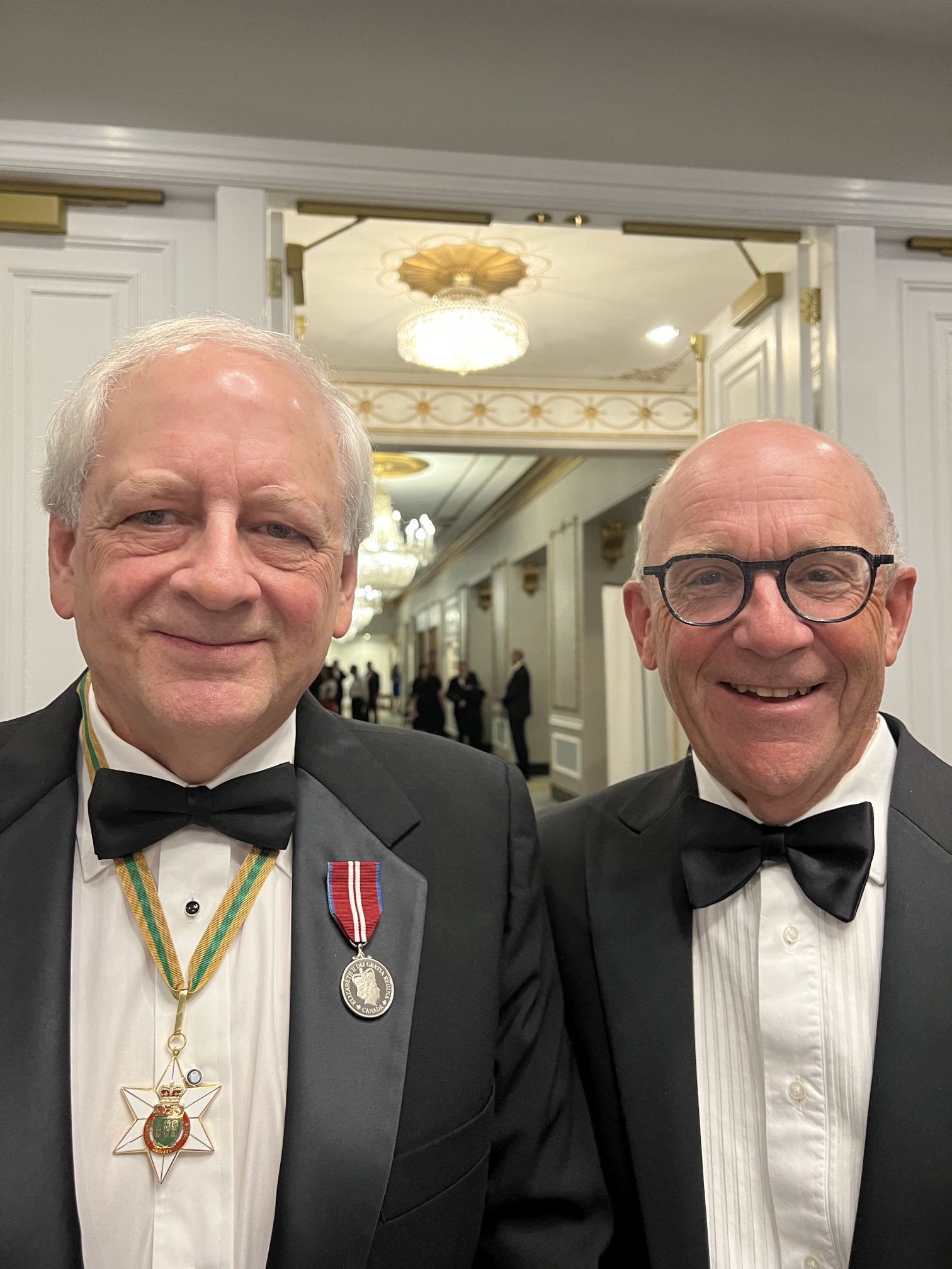 Dr. Alan Rosenberg (MD'74), left, and Dean Preston Smith (MD) pose for a photo together at the Saskatchewan Order of Merit ceremony in September. (Photo: @usaskmeddean - Twitter)