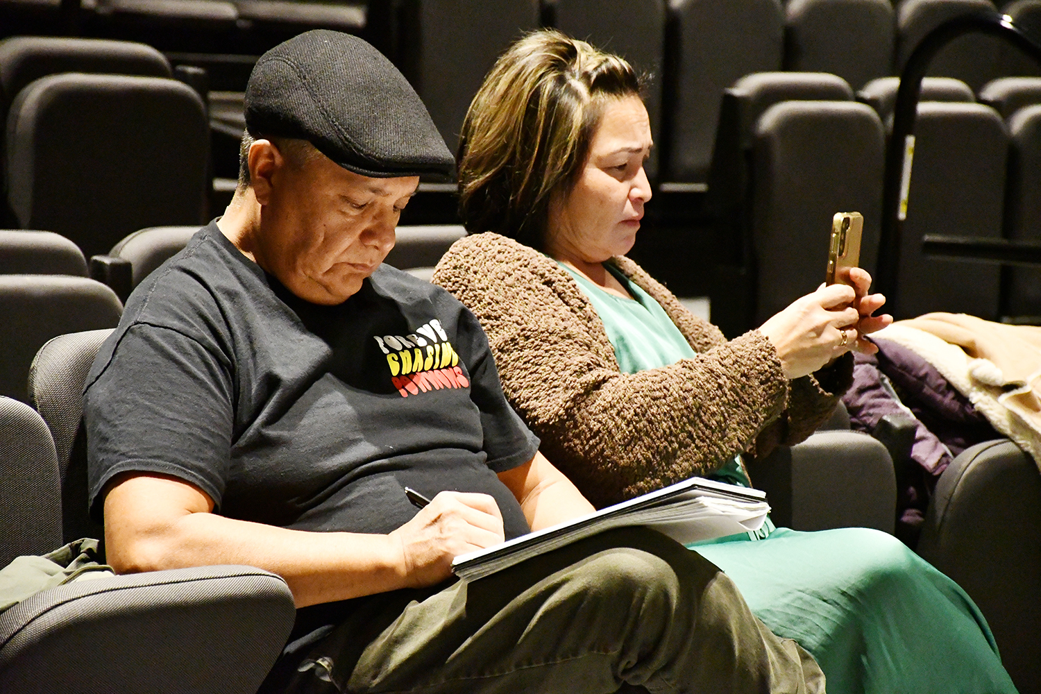 Ralph Morin and Dolores Pahtayken, researchers at Onion Lake Cree Nation, take notes and recordings during an event for Elders to share stories and knowledge in Cree. (Photo by Sarah MacDonald)