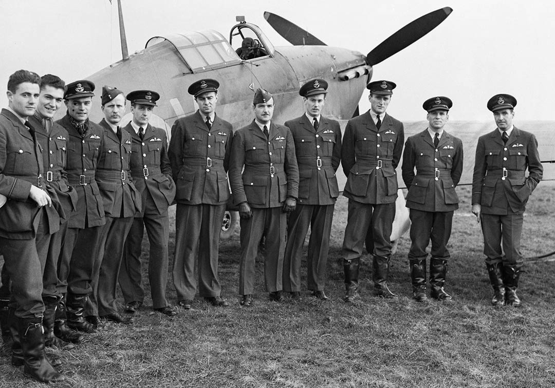 Squadron Leader Ernie McNab (fifth from right) and his fellow pilots from No.1 Squadron RCAF with one of their Hawker Hurricanes in Scotland on Oct 30, 1940. (Photo: Imperial War Museum)