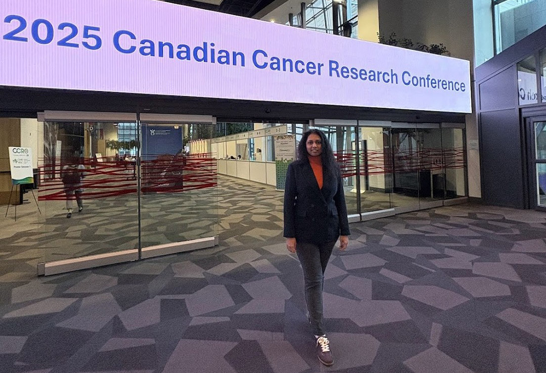 USask alumnae Dr. Harini Aiyer (PhD) at the entrance to the 2025 Canadian Cancer Research Conference that she played a leading role in organizing. (Photo: Submitted)